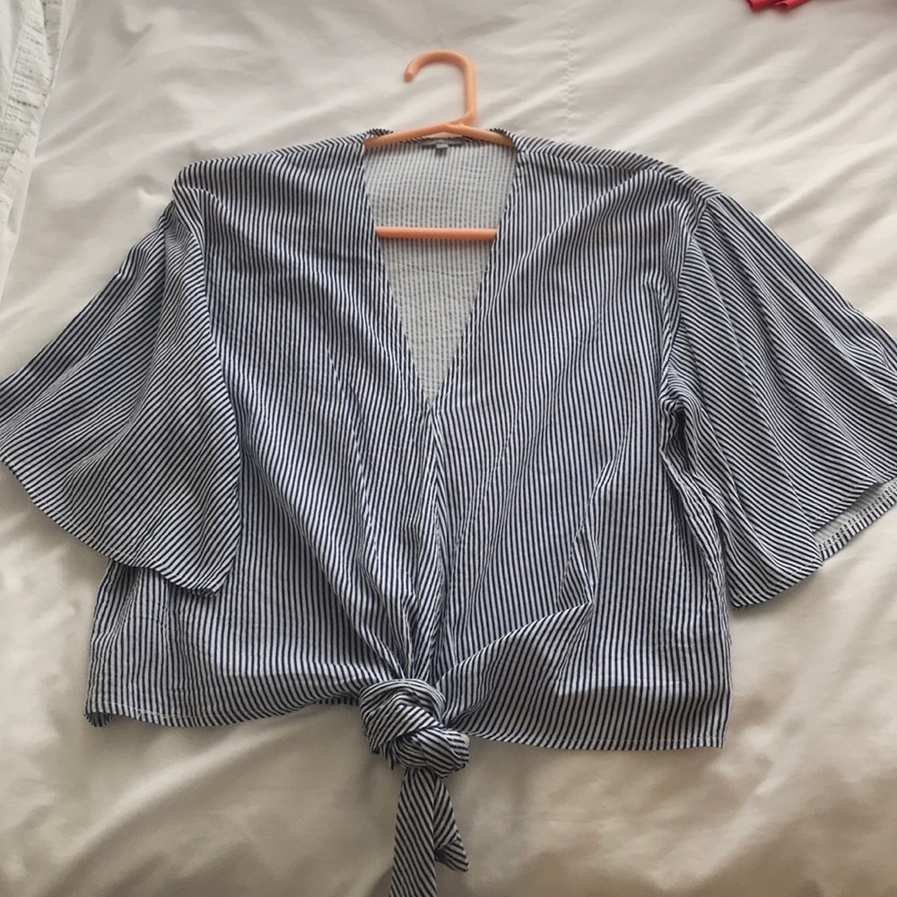 Stripped kimono style shirt with tie in front.